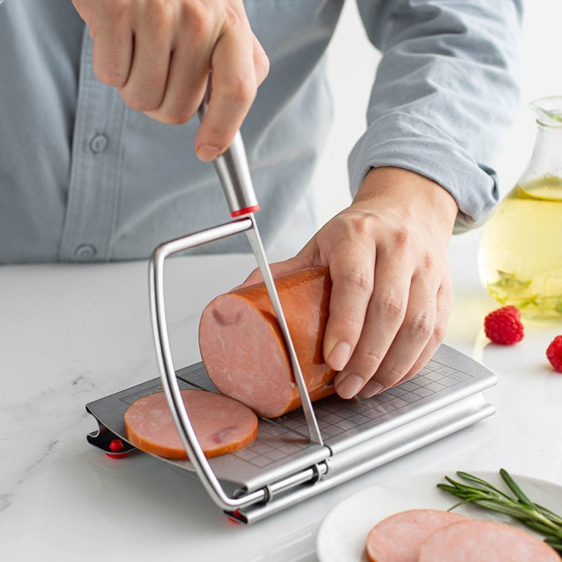 A stainless steel cheese slicer with scales-With scale
