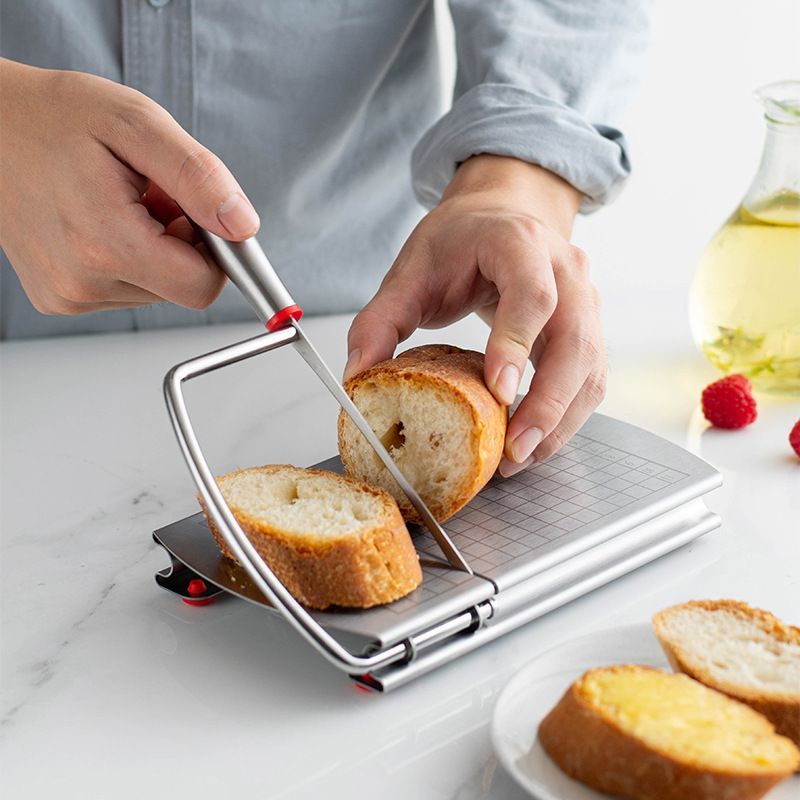 A stainless steel cheese slicer with scales-With scale