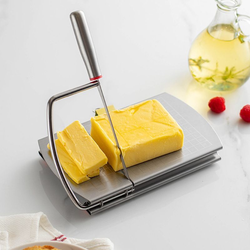 A stainless steel cheese slicer with scales-With scale