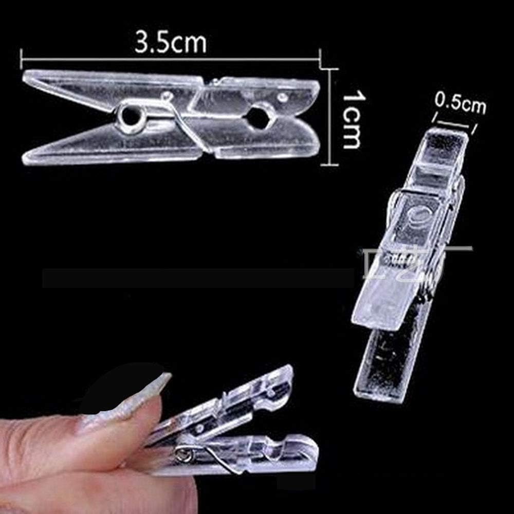 Yansanido 100pcs Mini Clear Plastic Utility Paper Clip, Clothespins Clips, Clothes Line String Clips, mini Clothes Pins for Photo for String Fairy Lights Color Clear 100pcs Clear Plastic Clips