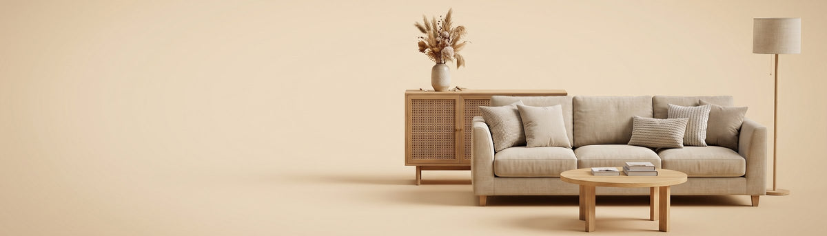 Oatmeal sofa, rattan sideboard, oak coffee table and floor lamp on a warm sand background